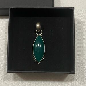 Sterling silver marquis shaped pendant. Green stone.